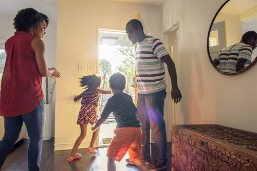 A family enjoying their tidy hall