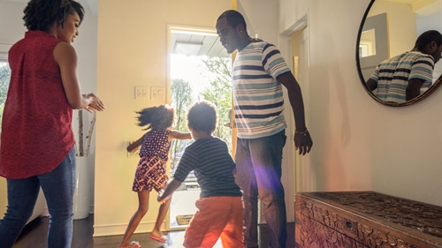 A family enjoying their tidy hall A family enjoying their tidy hall